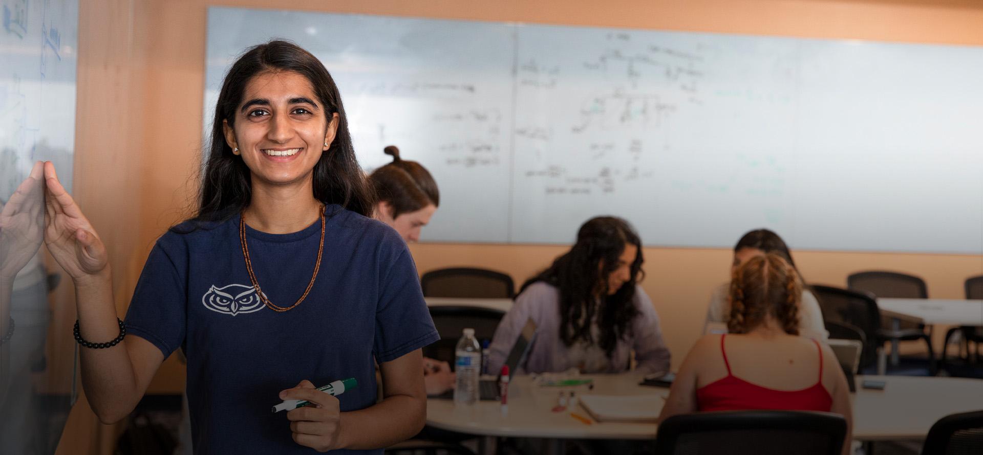  FAU student tutor in front of white board